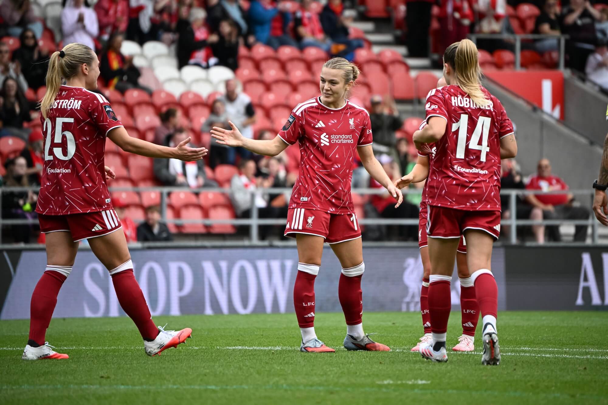 Liverpool FC Women's team celebrating together
